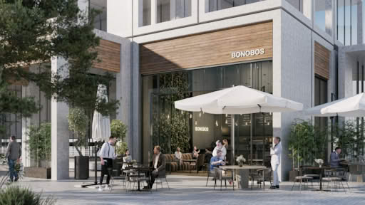 Bonobos storefront with outdoor seating and white umbrellas.