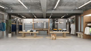 Wide view of Dickies flagship store interior featuring clothing racks, wooden tables, and clean modern layout.