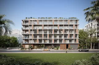 Modern apartment building with balconies and palm trees in Jumeirah Village Triangle.