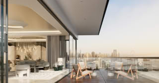 Modern living room with panoramic city view and outdoor seating.
