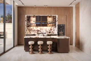 A modern kitchen with marble countertops and wooden cabinets.
