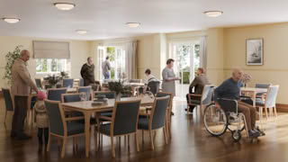 People in a dining area of an elderly home care facility.