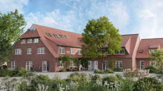 A rendering of a brick building with red-tiled roof and people relaxing in garden.