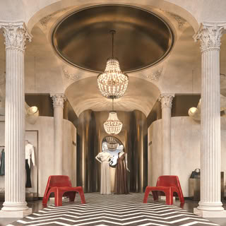Neo-classic boutique interior with chandeliers, columns and fashion displays