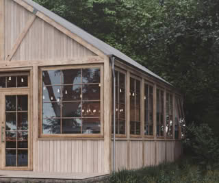 Scandinavian café wooden façade with large glass windows surrounded by forest.