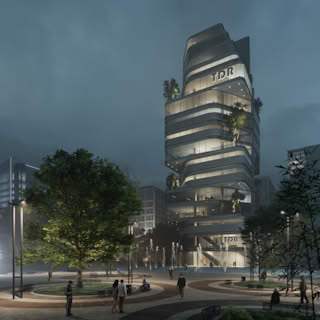 Night view of TDR Tower with illuminated glass façade, modern architecture, and landscaped public plaza.