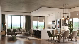 A modern living room and kitchen with green accents large windows.