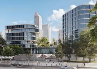 Modern skyscrapers with curved glass facades and people in a plaza.