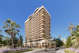 A modern residential building with balconies and palm trees in front.