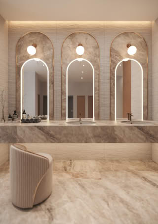 A luxurious bathroom with three arched mirrors and marble surfaces.